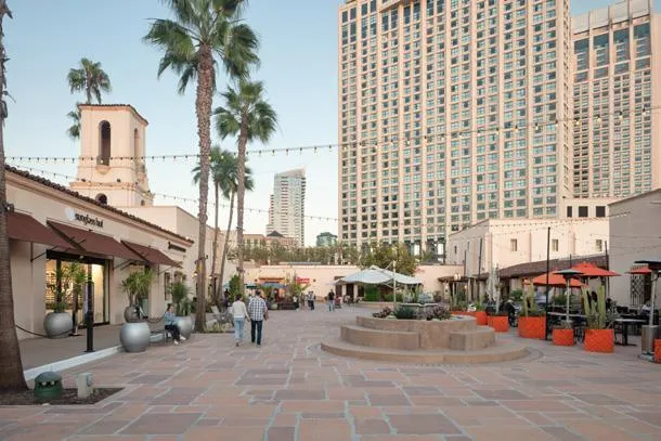 Courtyard plaza with palms and the Manchester Grand Hyatt tower behind