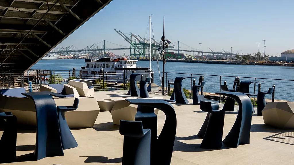 Waterfront terrace at West Harbor looking across the main channel to the Port of Los Angeles cranes
